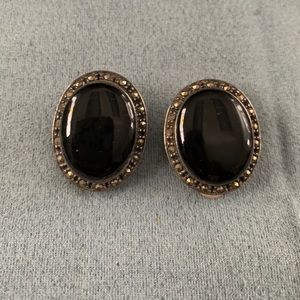 Black enamel and 925 clip on.